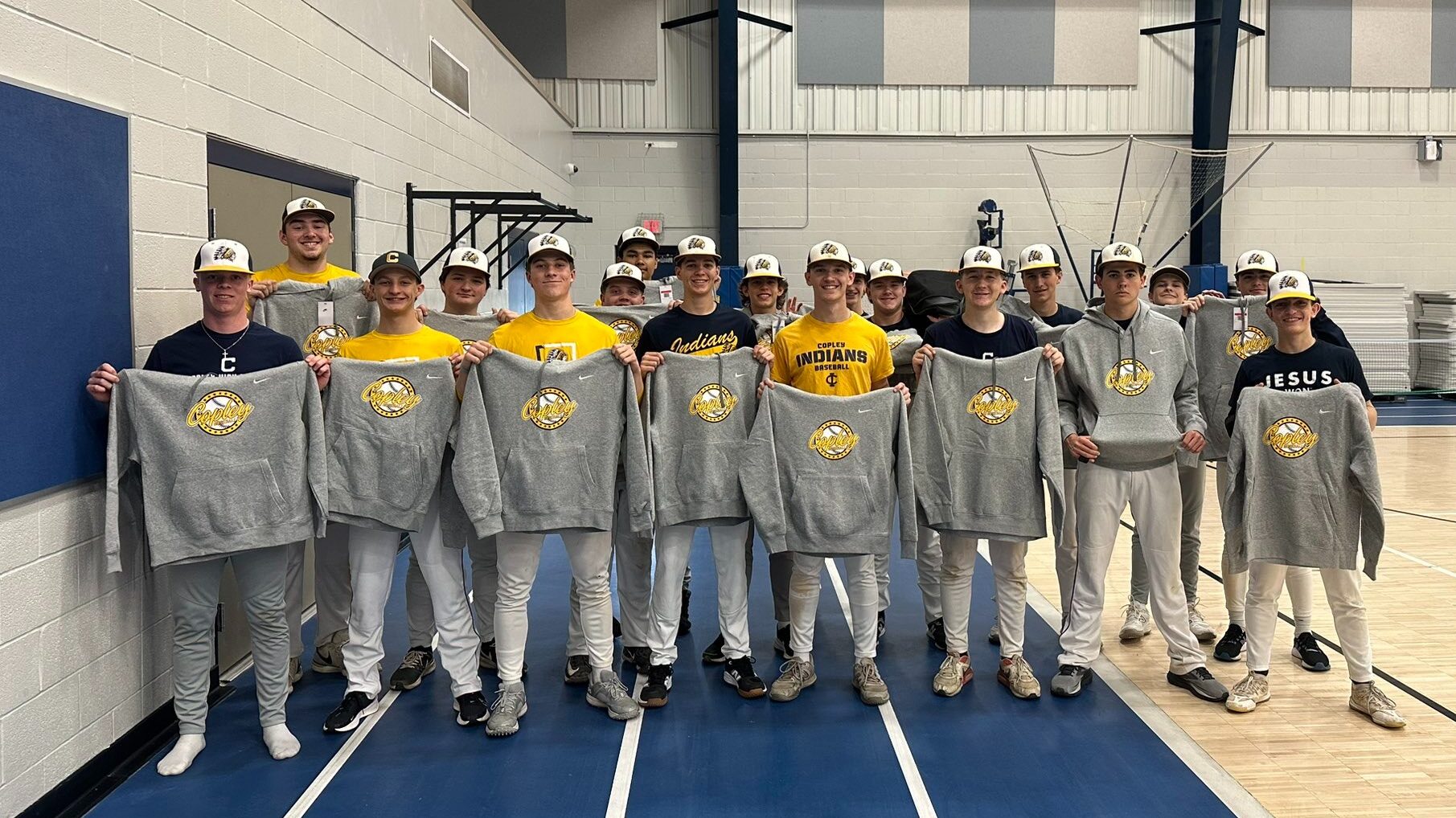 Copley Baseball showing off the prizes they earned through their Gold Athletics fundraiser.