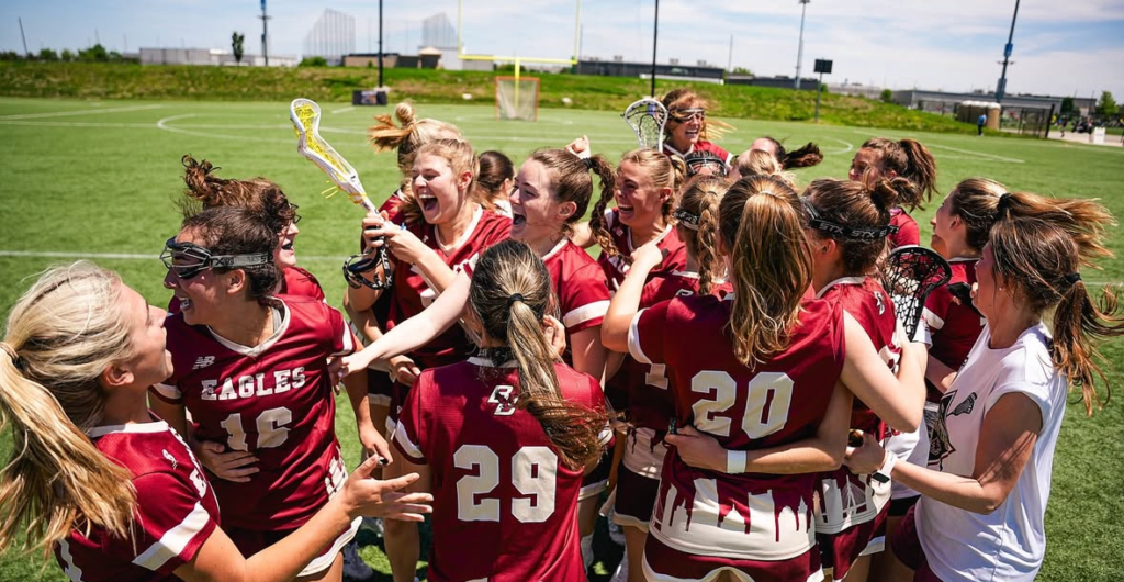 Boston College Women's Club Lacrosse celebrating after a win.